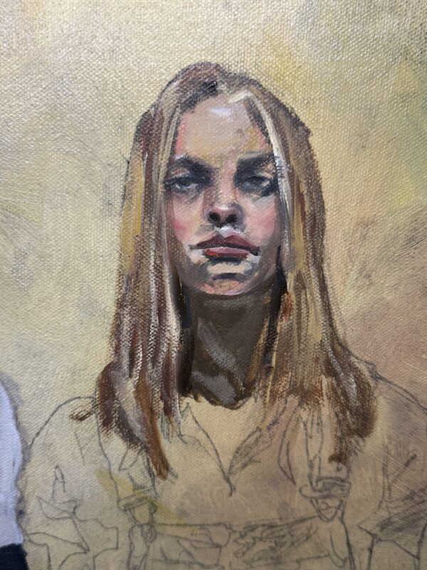 Close view of the blonde woman’s painted face above her sketched clothing in Defiance