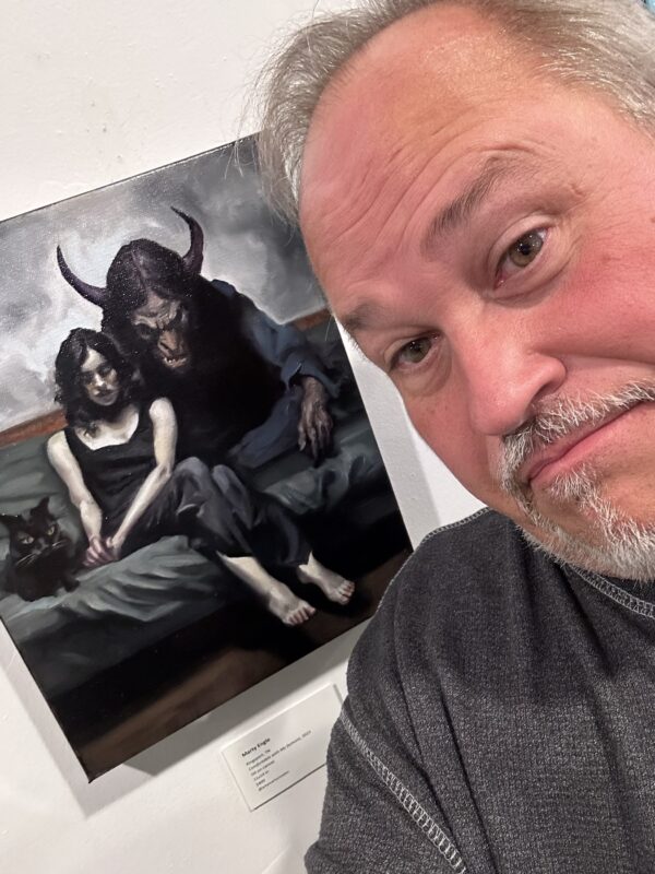 Marty Engle beside his Comfortable with My Demons painting on display