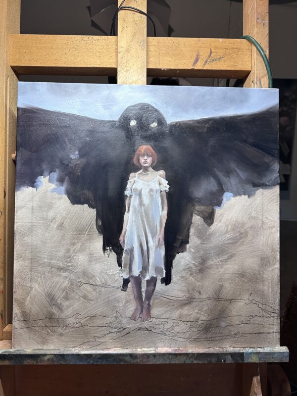 Mothman painting on the easel with dark wings emerging behind the white-dressed figure